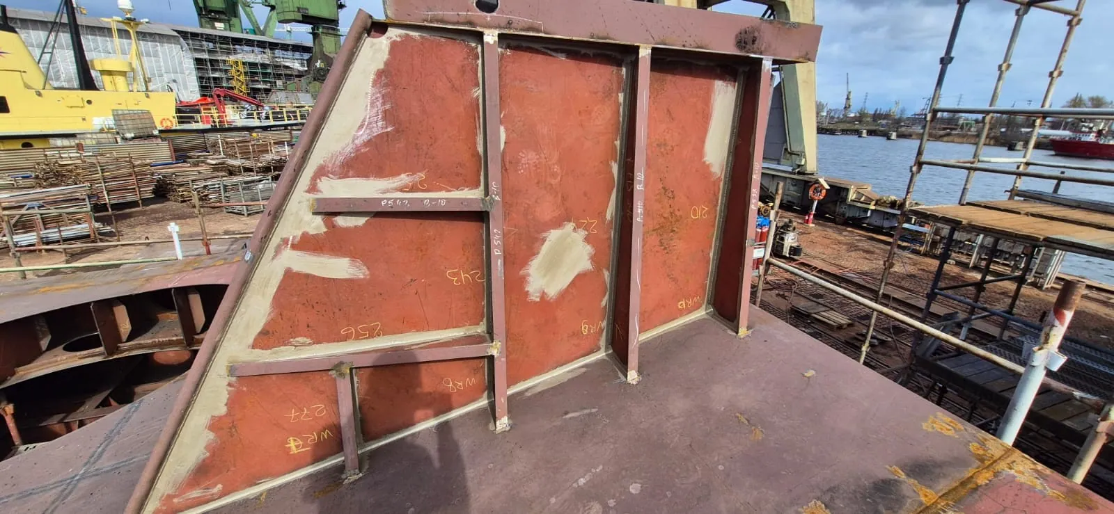 Hull construction work at RS Marine, welded steel structure inside dry dock